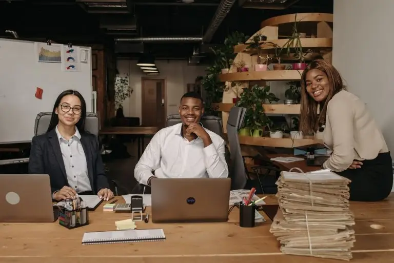 A team of business professionals working together in a modern office setting.